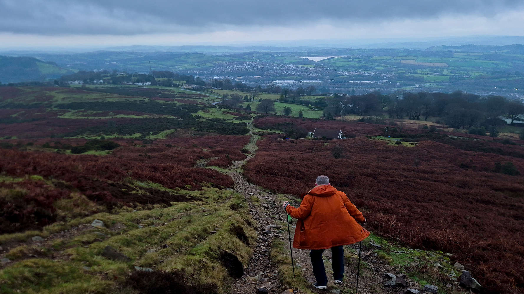 Gwyn descending towards the cottage & car.