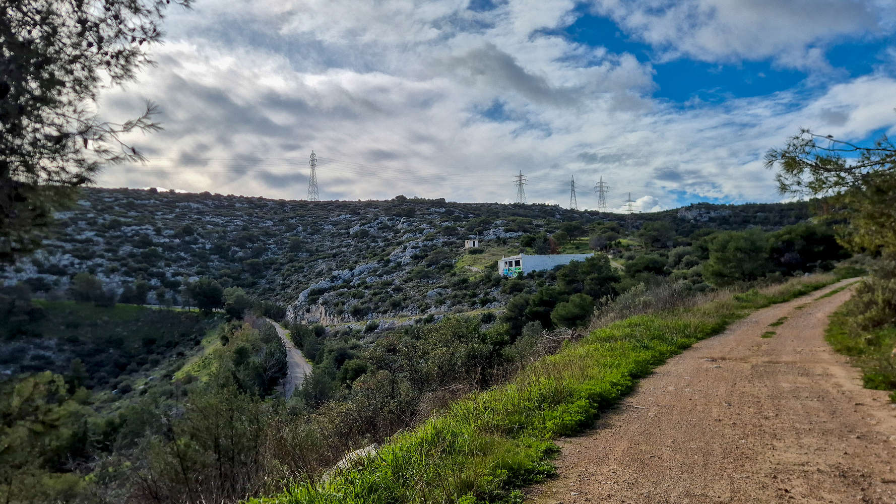 The pylons mark the E-W summit ridge.