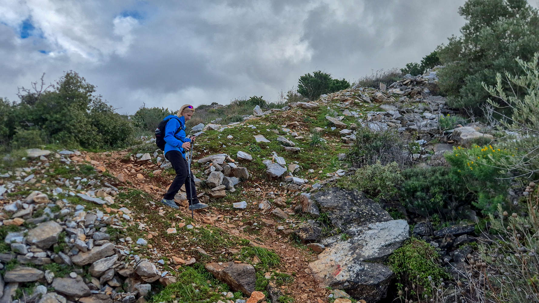 Descending among ancient spoil-heaps.