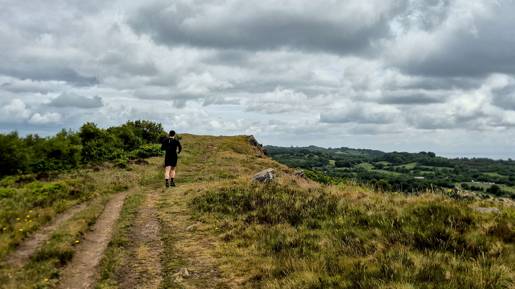 Runner at the top of Craig yr Allt (273m).