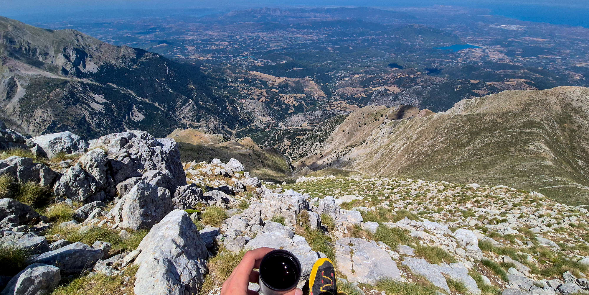A cup of mountain tea with 2,000m of air below my feet.