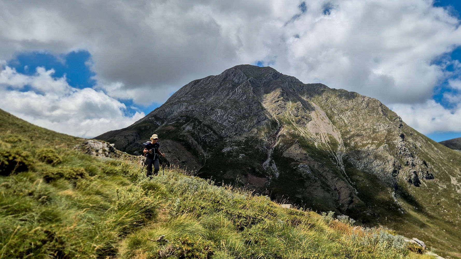Terry traversing away from the plateau, Olonos (2,223m) behind.
