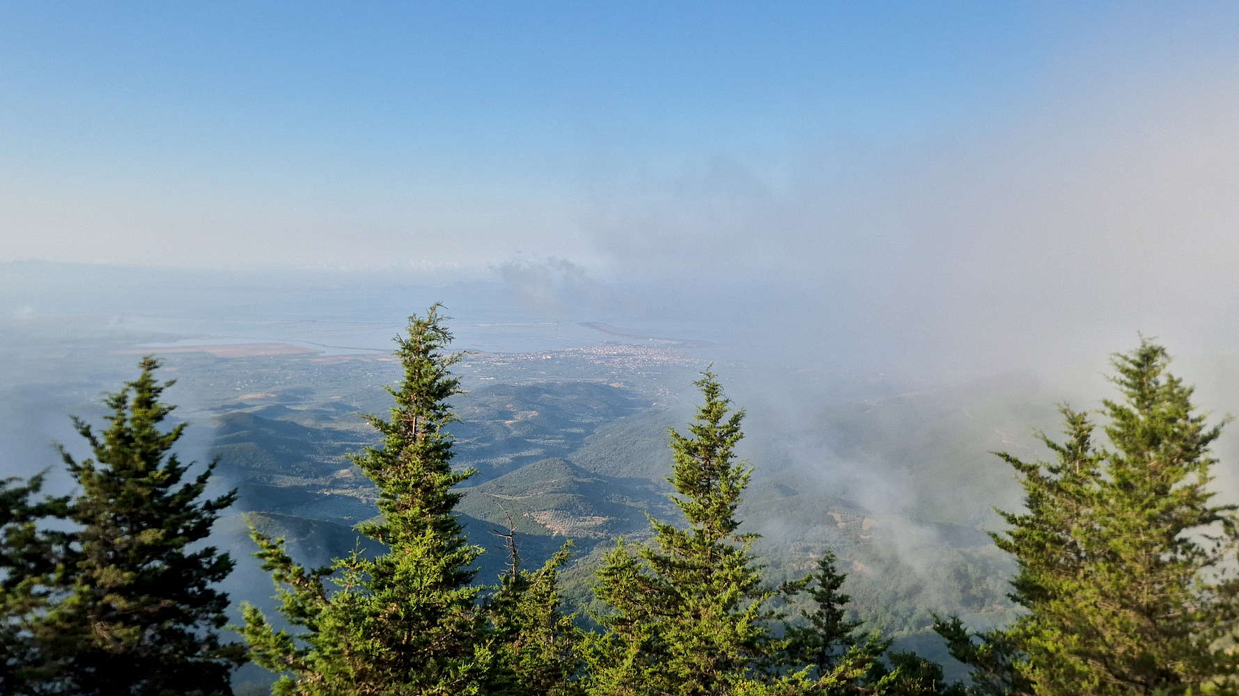 Clouds parting near the summit.