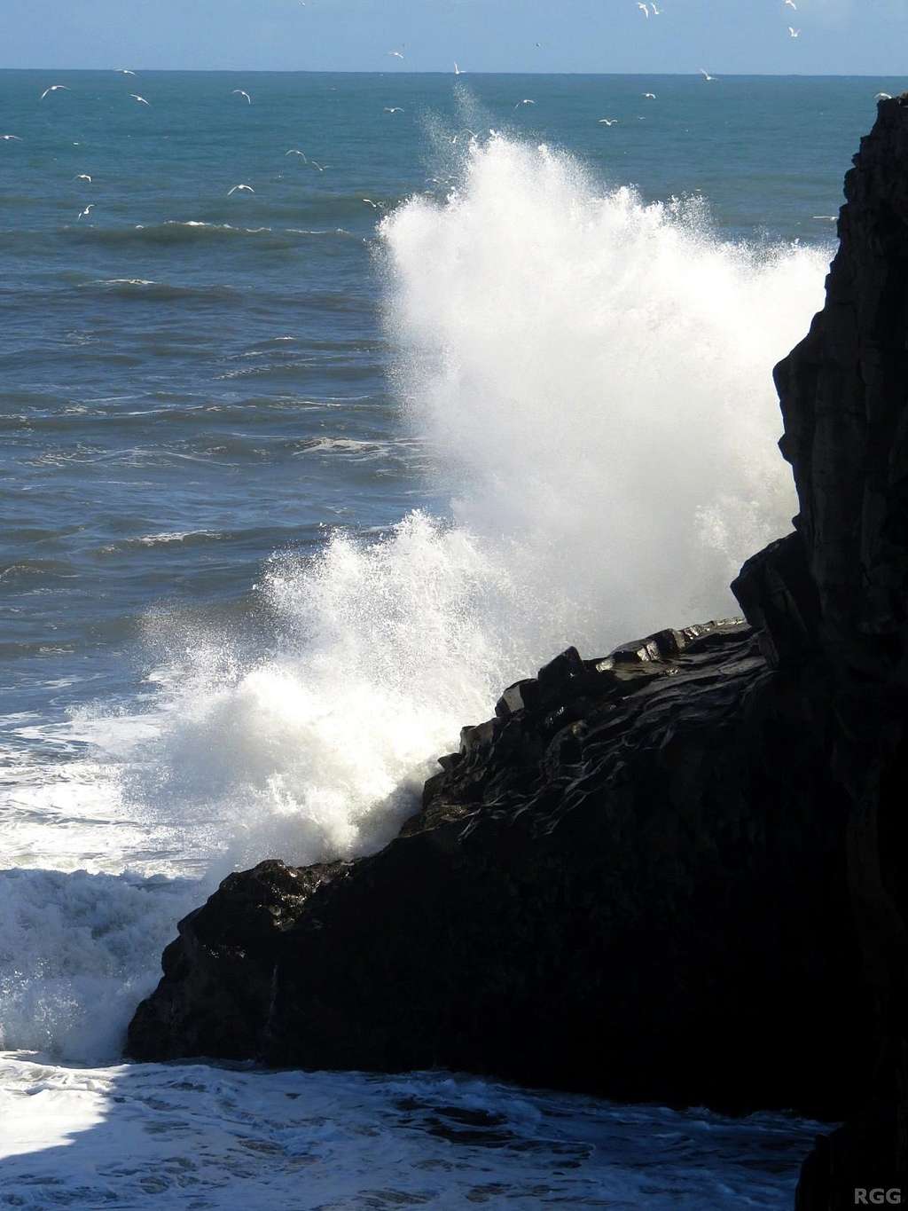 Waves crashing into the rocks at Dyrhólaey