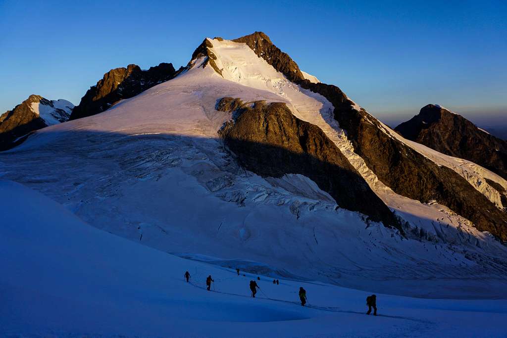 Climbers in front of Piz Bernina (13284 ft / 4049m)
