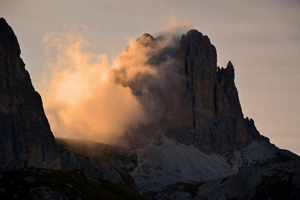 Sunlit evening cloud veiling the Sforcella / Tscheiner Spitze