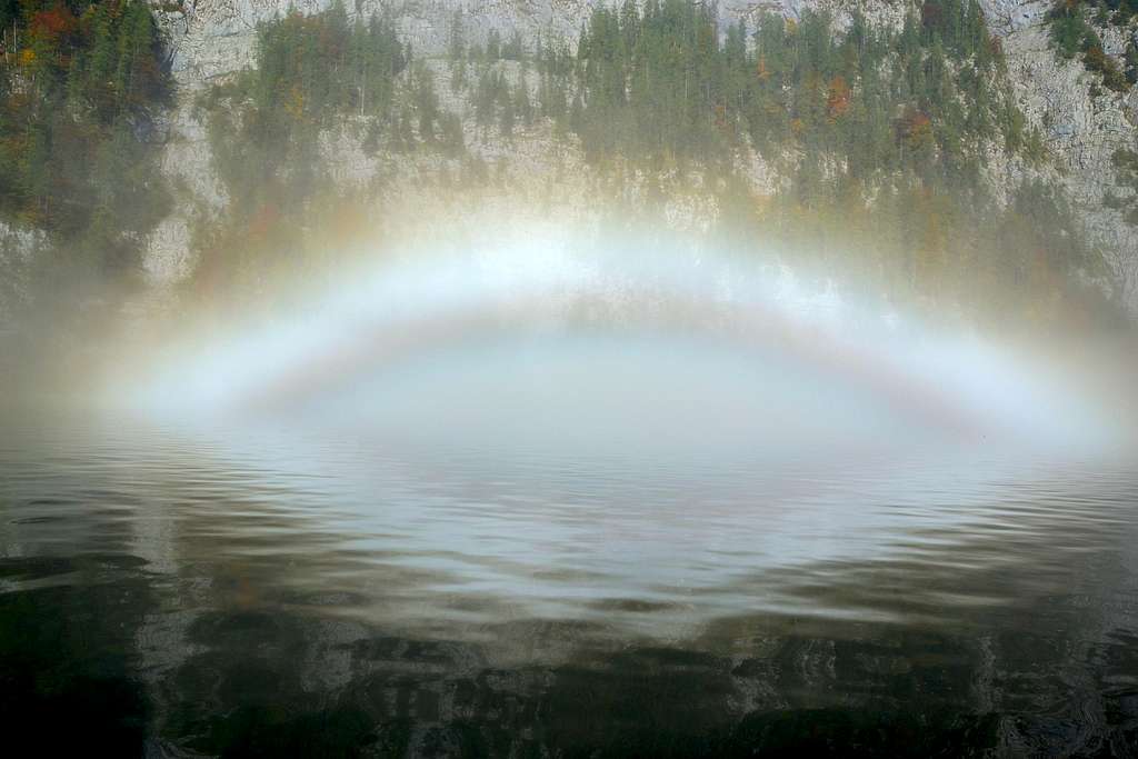 A rainbow on top of the water
