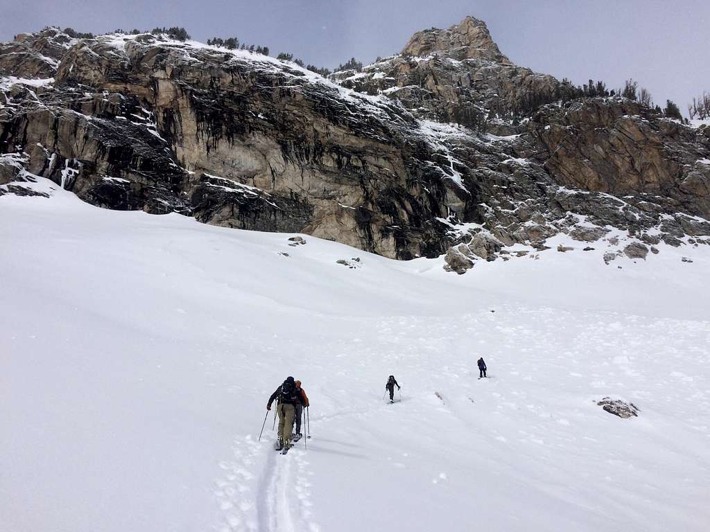 Skiing beneath the cliff at the base of Disappointment Peak
