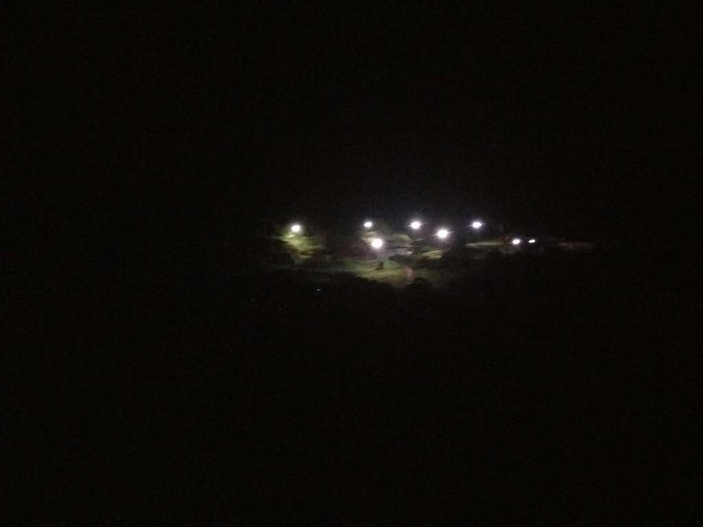 Temple complex at night, from the village