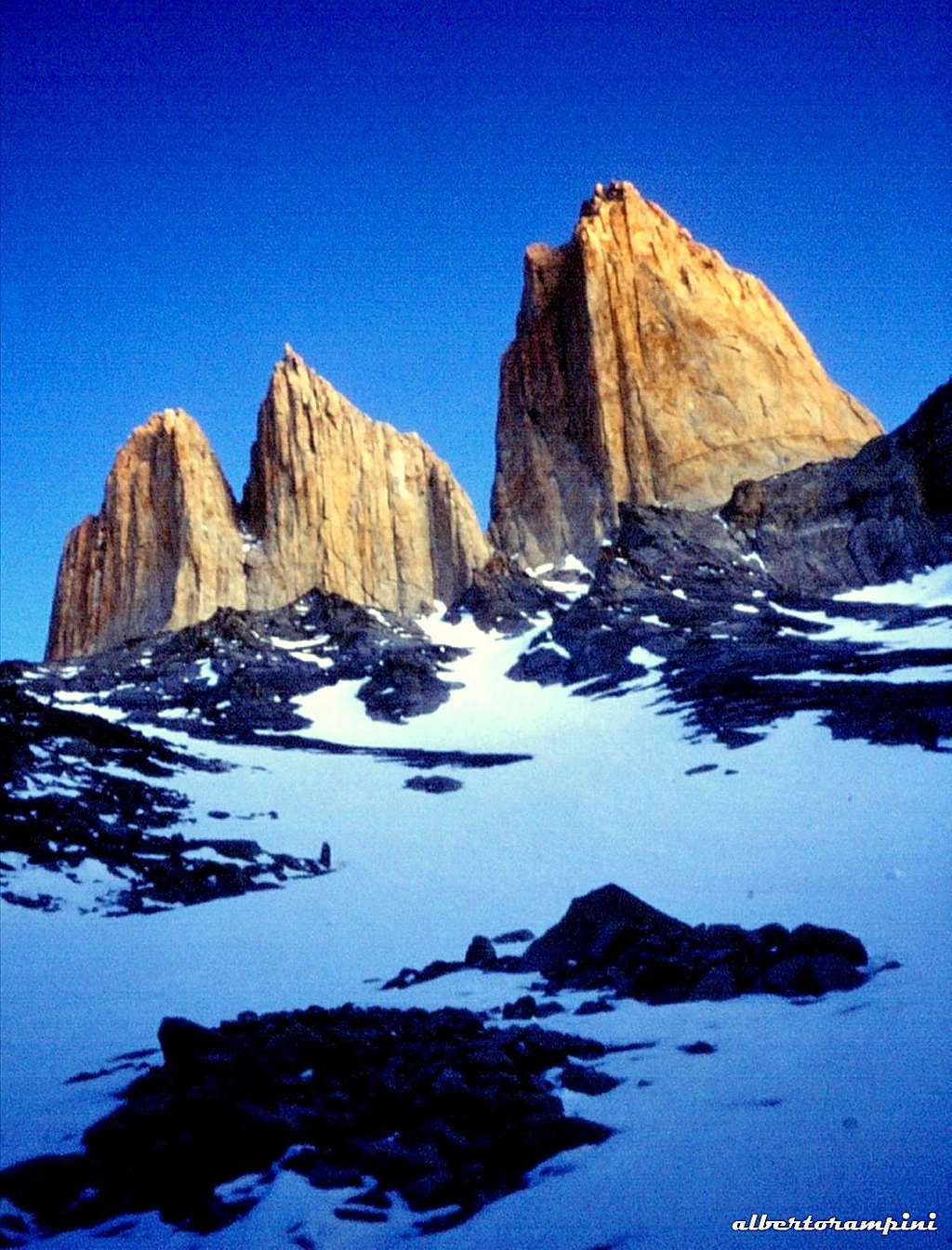 The summits of Torres del Paine emerging during the approach from West