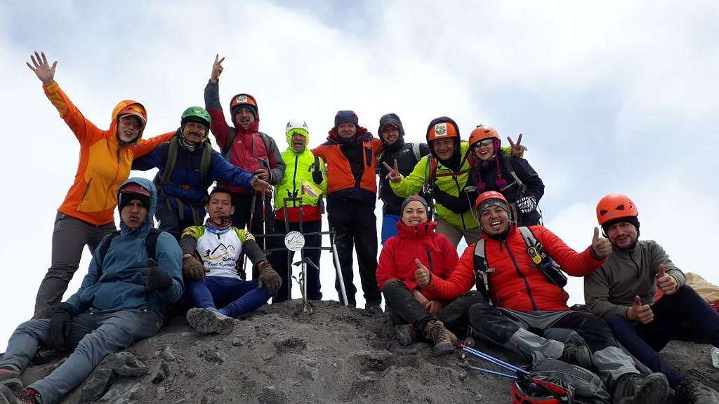 Banos Trail Running with their cross on Tungurahua summit