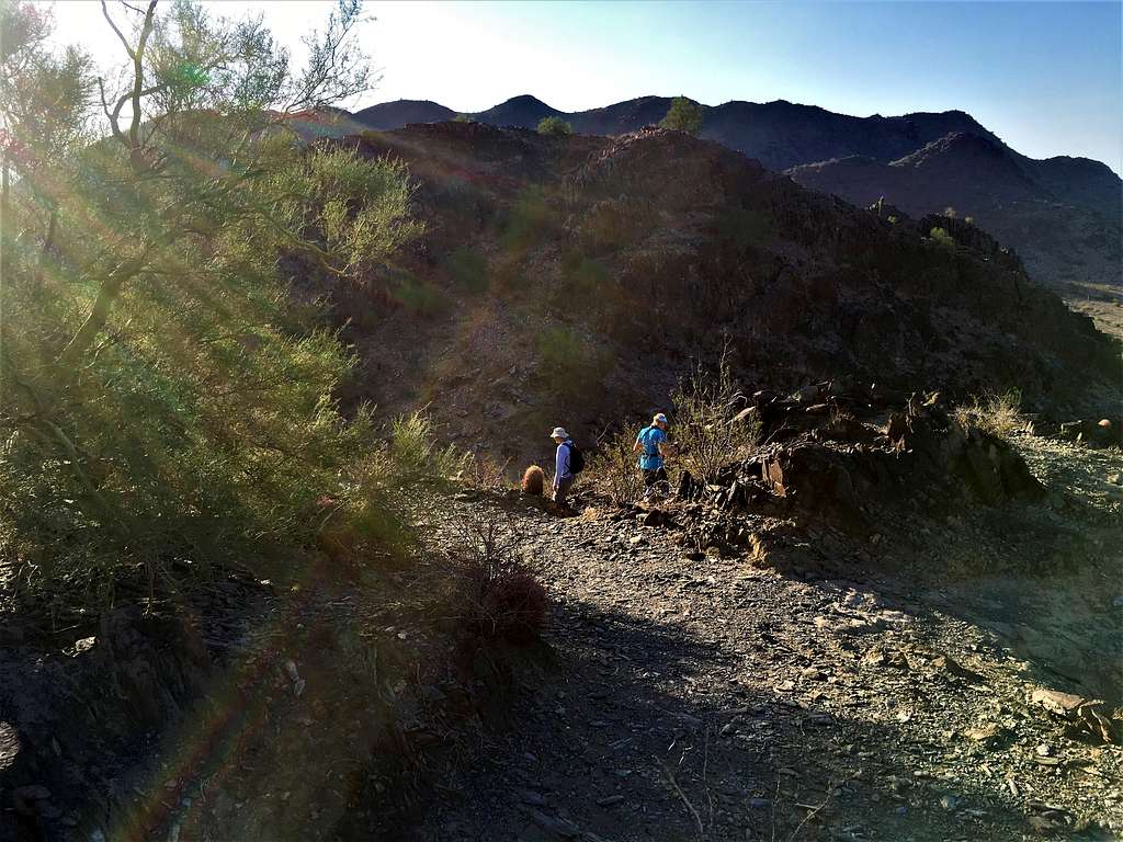 Hikers down at the saddle below the true summit