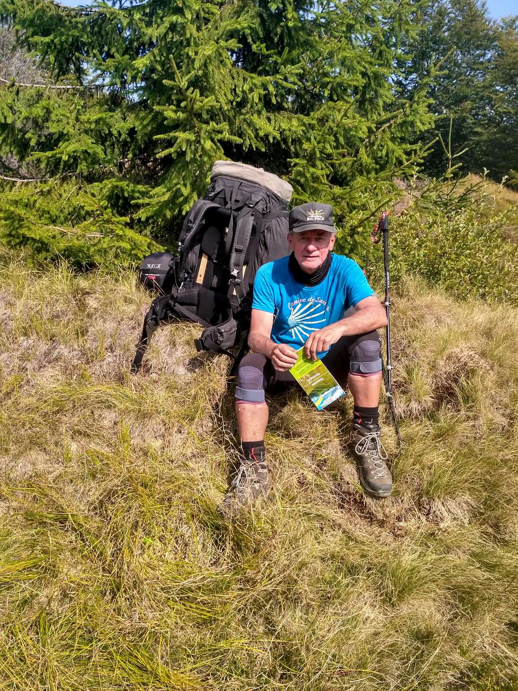 64 years old trekker with 30 kg backpack