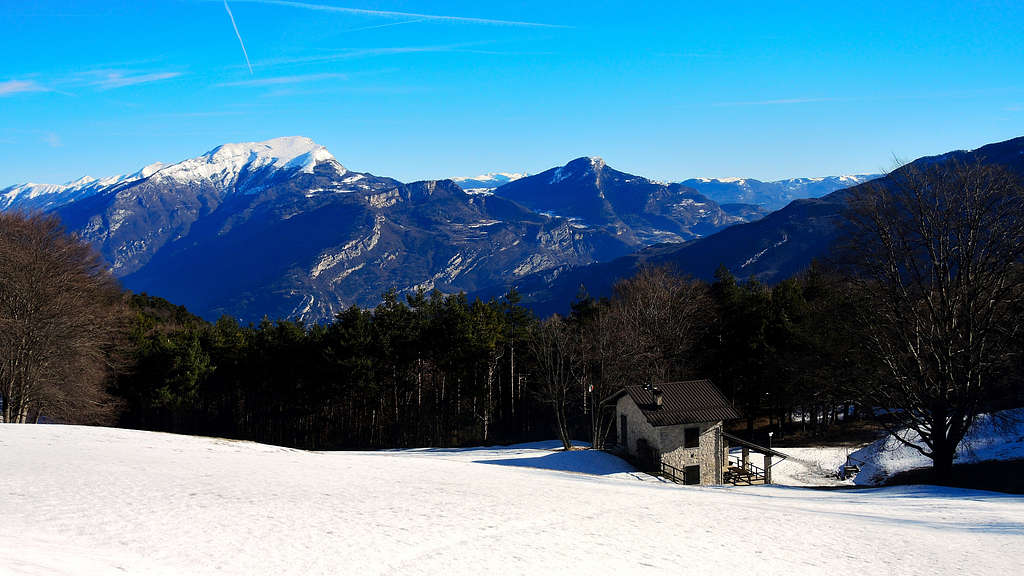 The beautiful snow-covered clearing of Malga Palaer