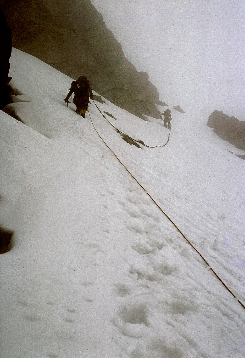 Mt. Stuart - traversing the upper snowfield in the clouds beneath the false summit