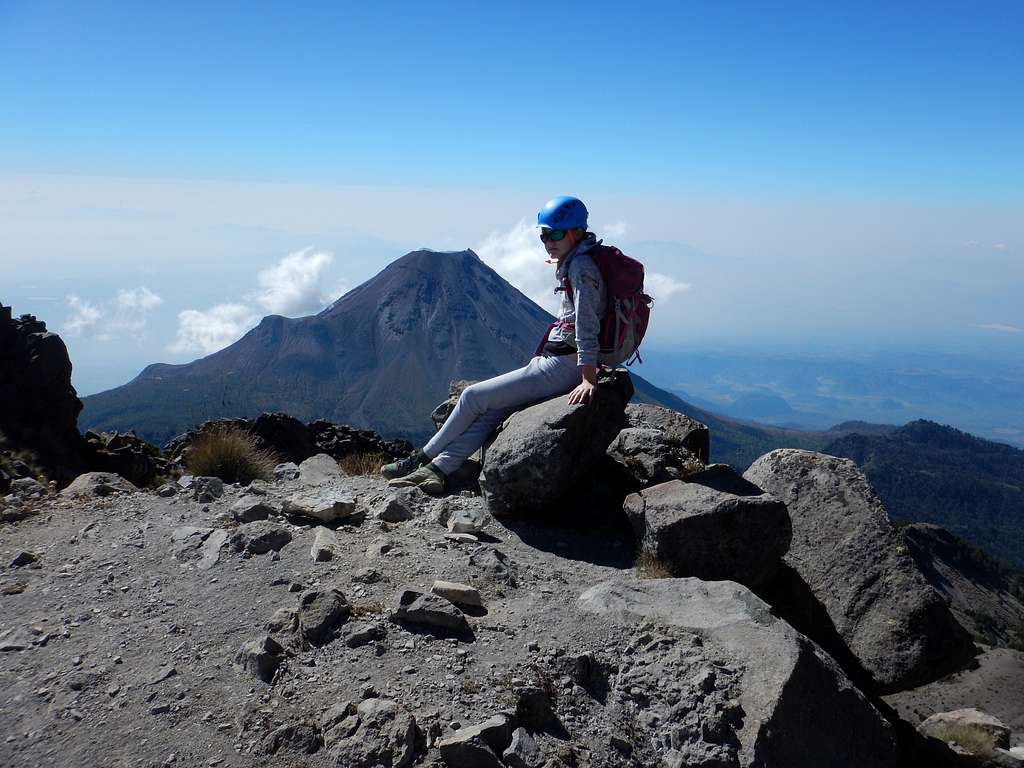 Shaylee on the summit of Nevado de Colima.  Volcan de Colima is in the background