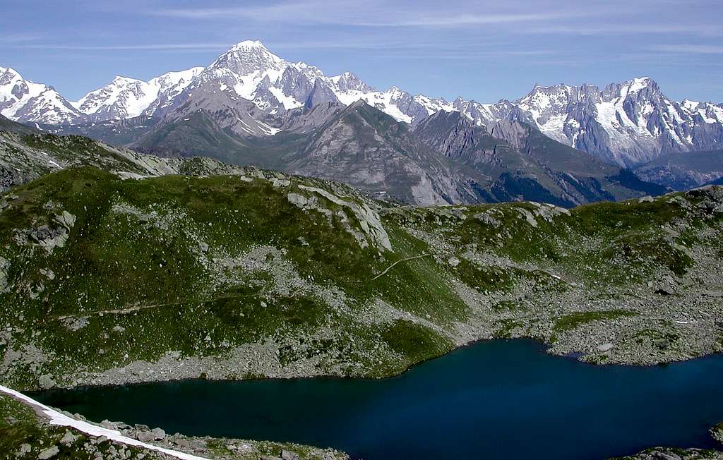 First lake of Bella Comba during the ascent to the Tachuy lakes, and Mont Blanc Group