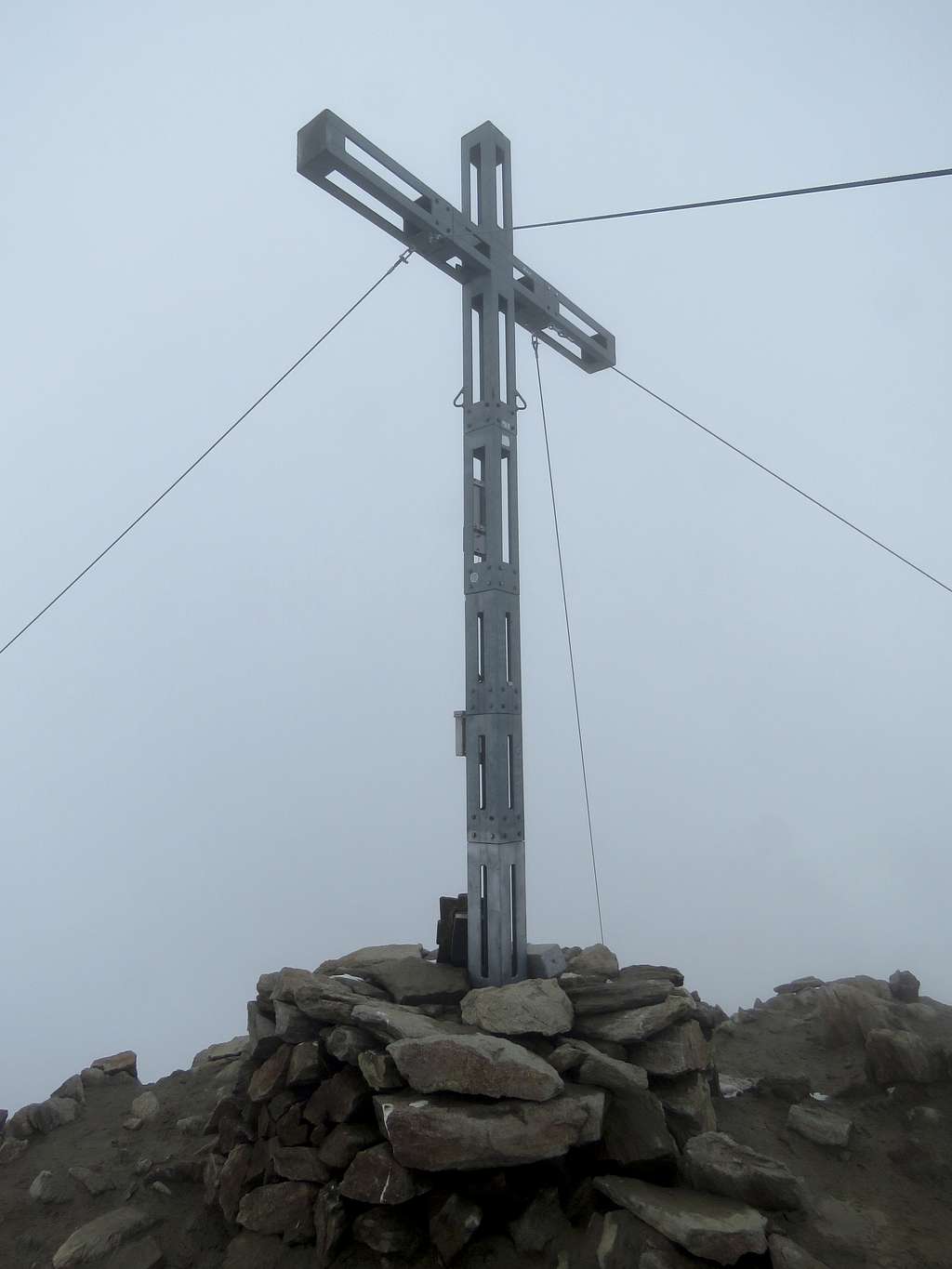 Summit cross in a cloud