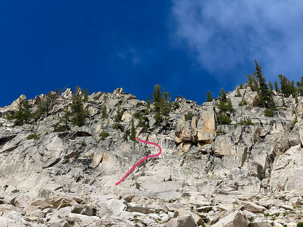 The base of the climb. There is a hand crack at the pink line. 5.1'ish. Then a ramp up and left.