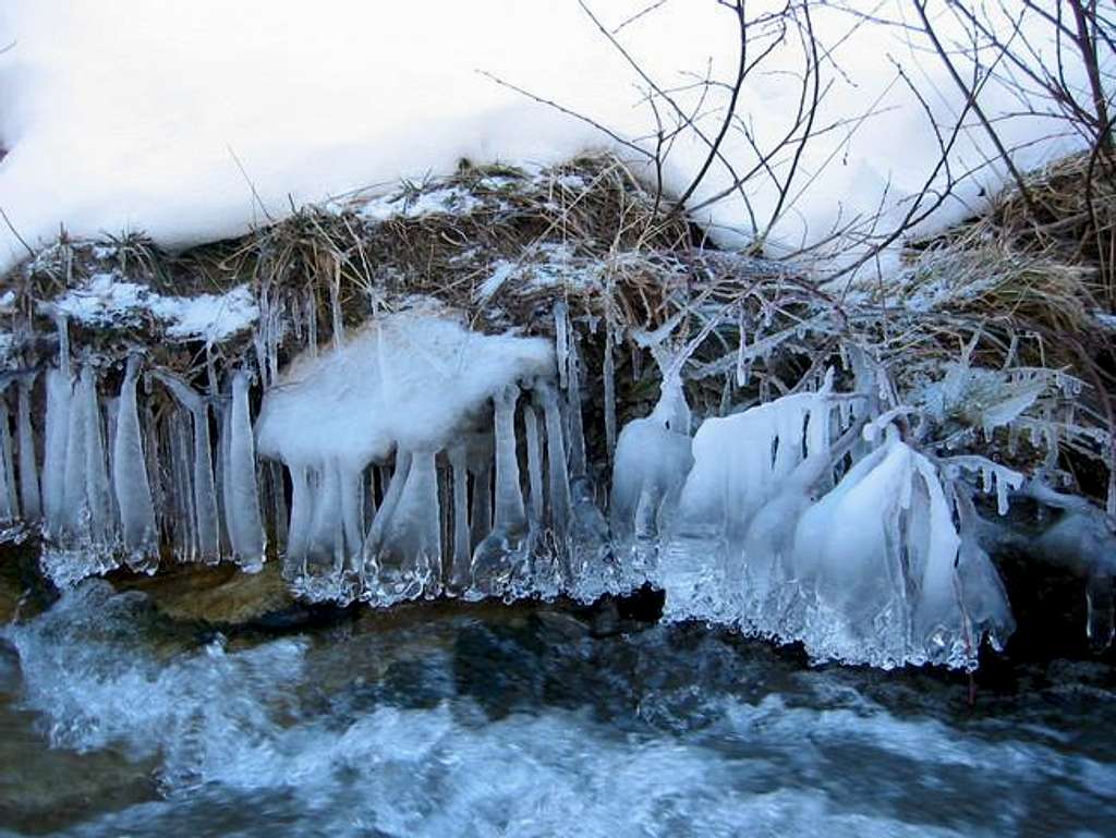 Frozen water of a stream, on...