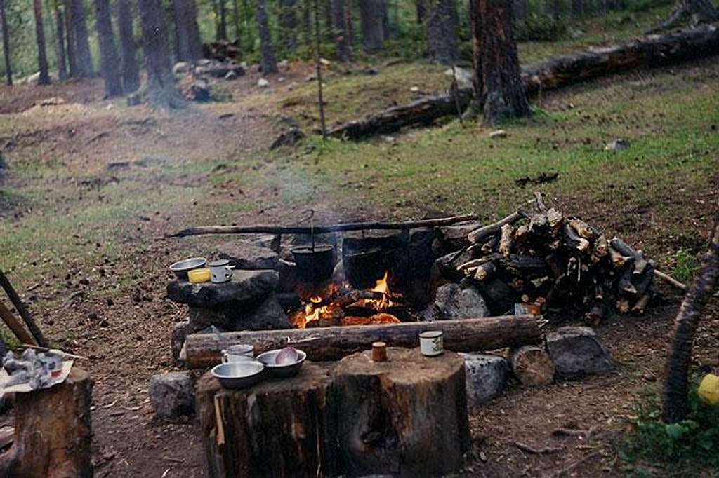 Camp fire and kitchen at...