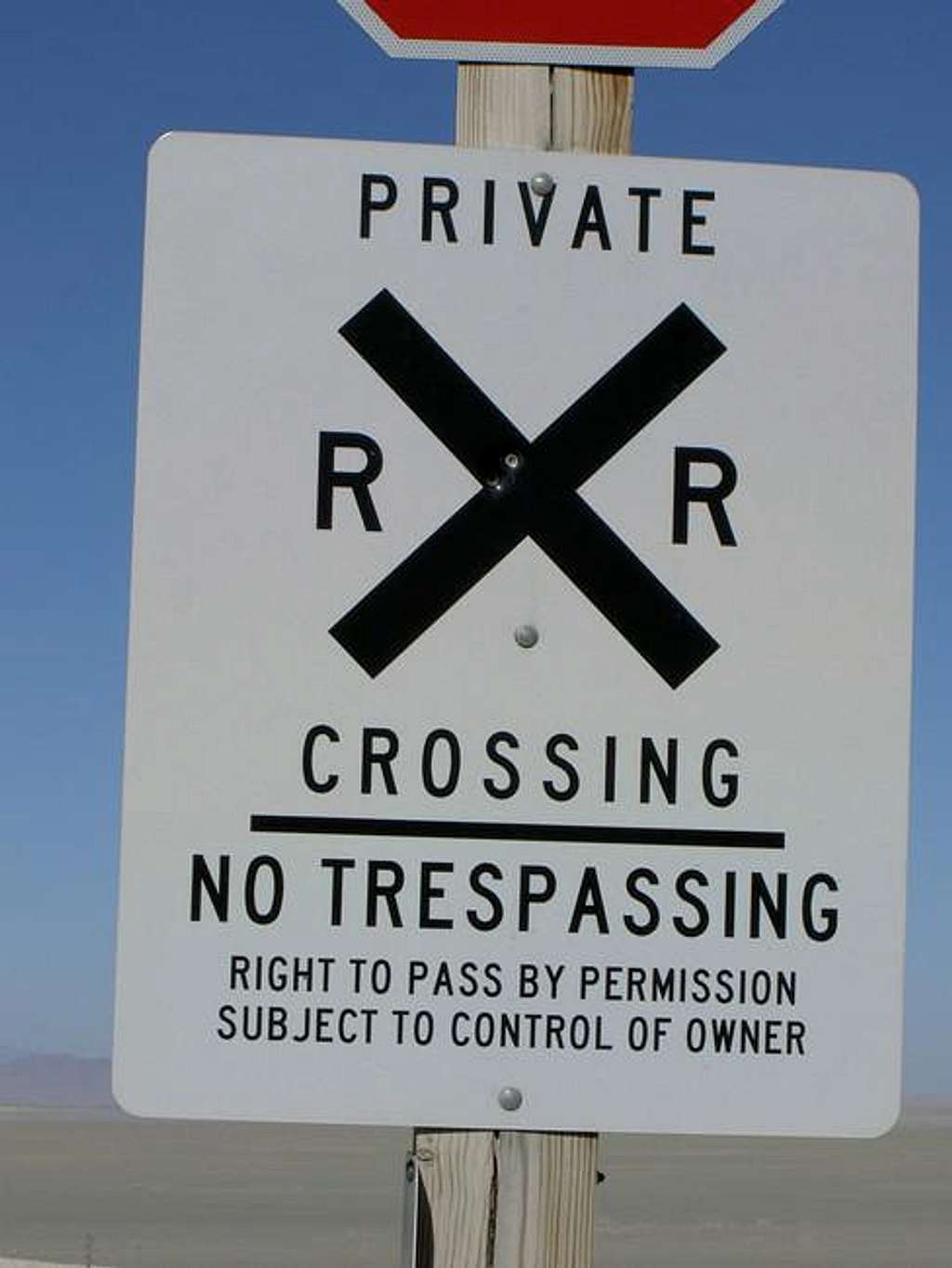 The sign at the railroad.