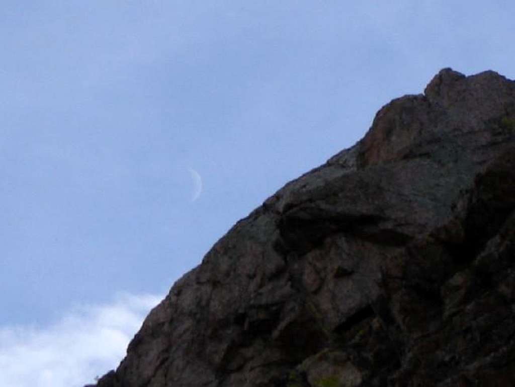 A young crescent moon seen...