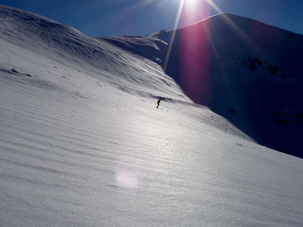 A skier on the slopes below...