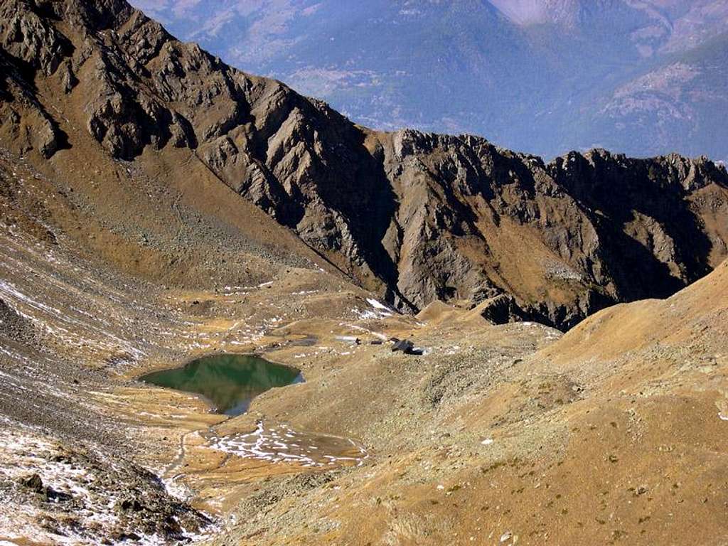 Arbolle Hut and Lake from Col Garin.<br>In the background Colle di Chamolè