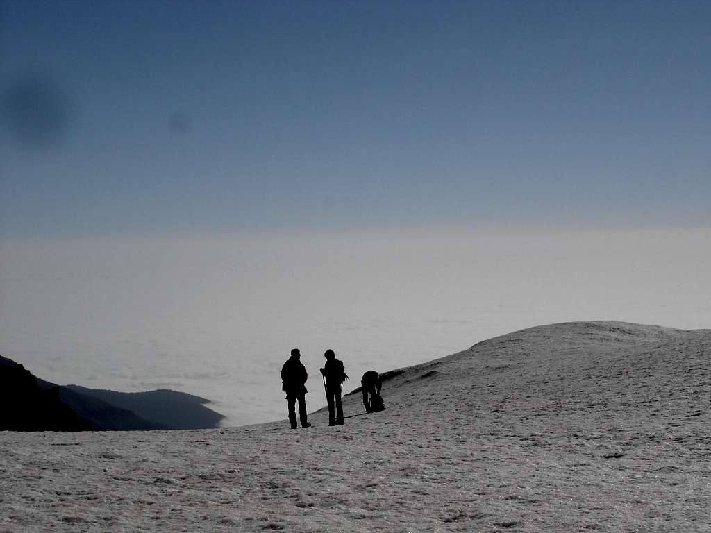 3 of the 4 climbers and the clouds above the Caspian sea