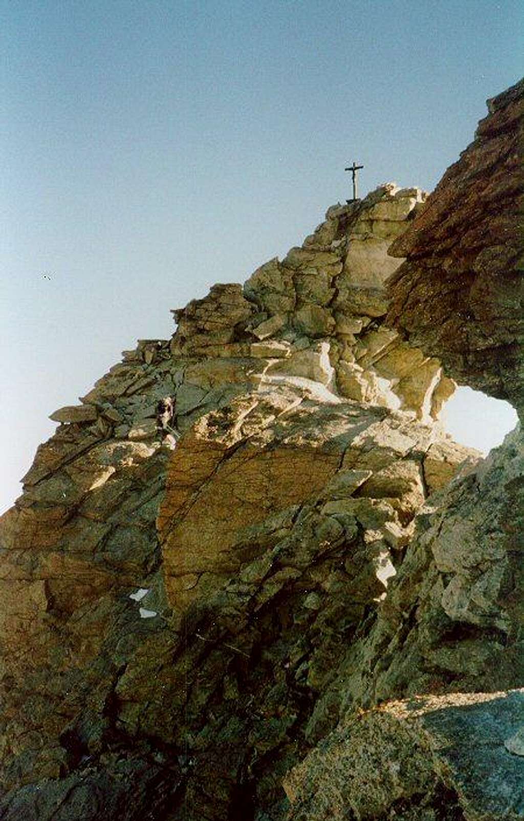 Climber approaching the Zinalrothorn summit cross