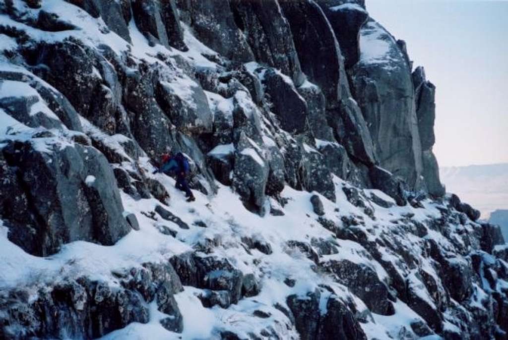 Downclimbing the east face of...