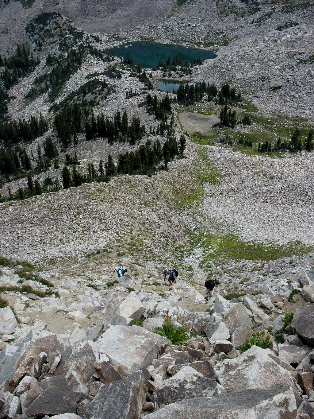 Looking down on hikers ascending trail to east ridge