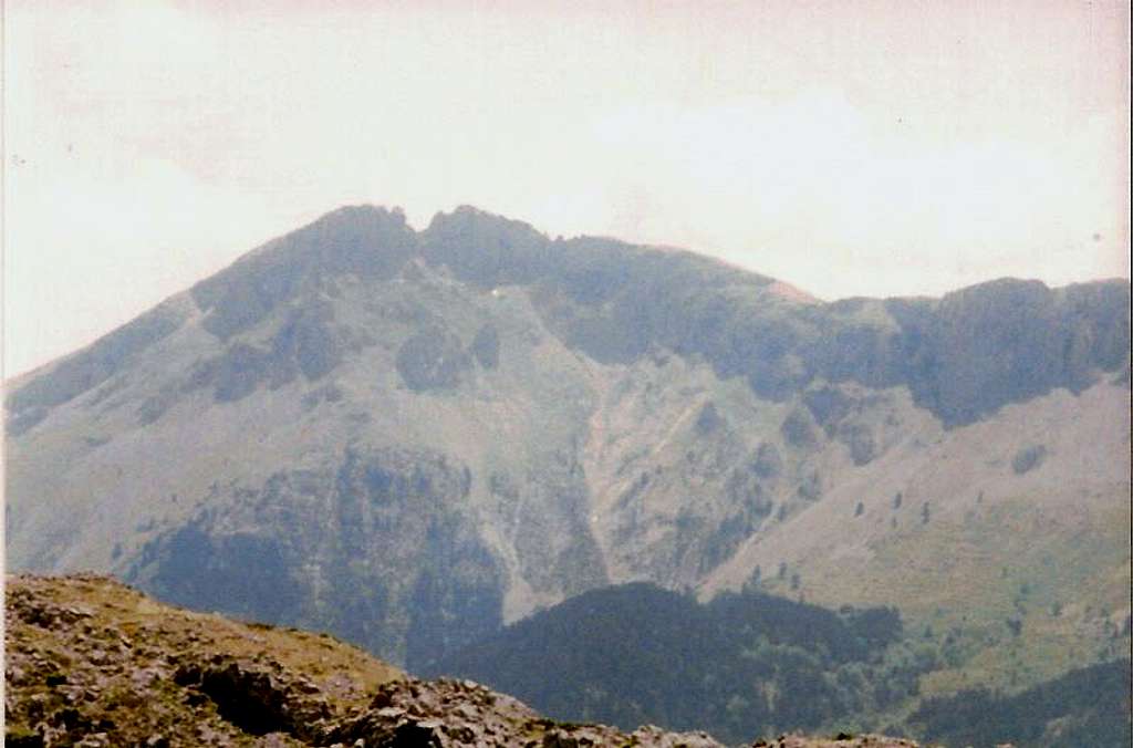 Portaris peak,the coulouir and steep slopes below it.Some remaints of snow can still be seen in the slope.22 June 2006