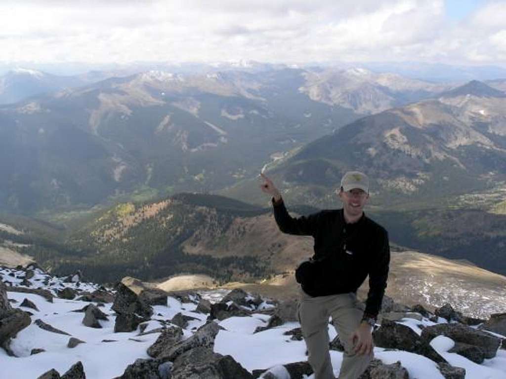 Lonny, pointing to the trailhead on Cottonwood Pass from the summit