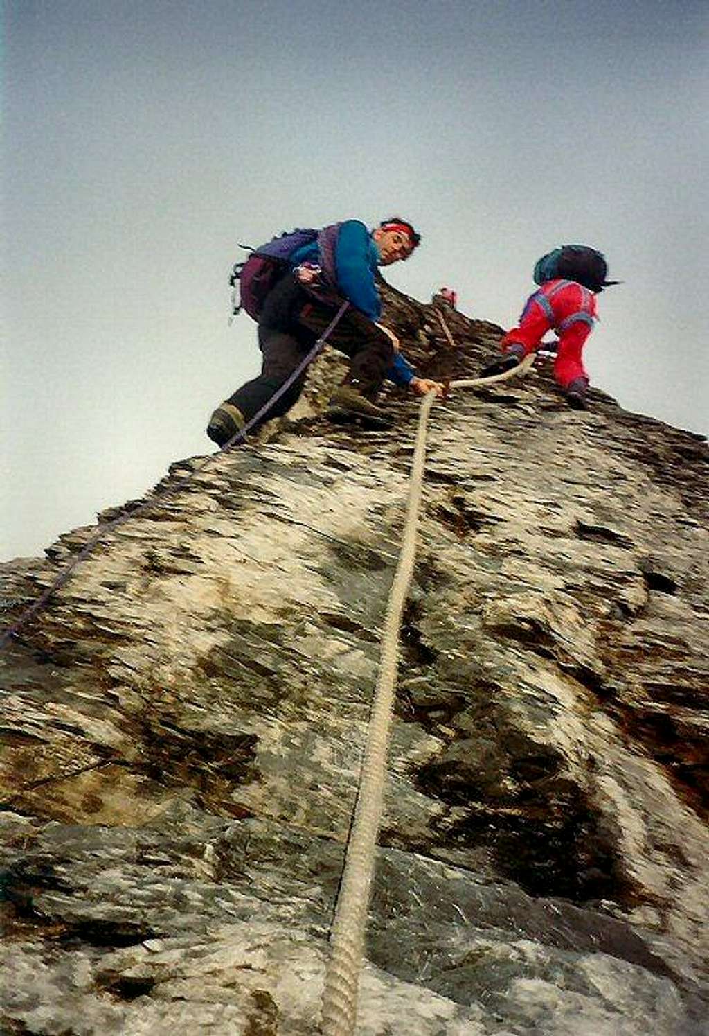 Climbing the first fixed rope on the Mittelegi ridge