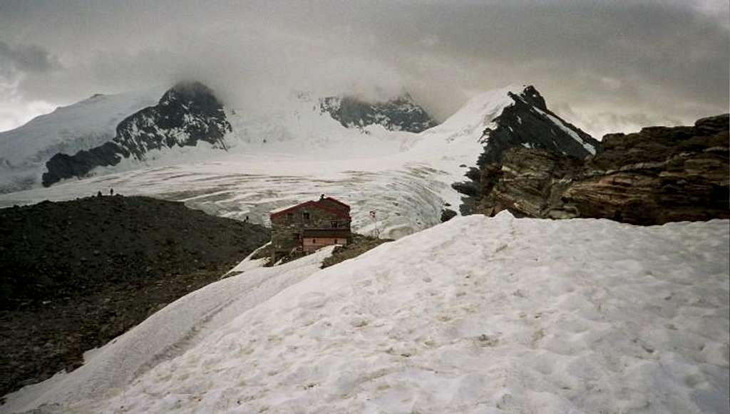 Tracuit hut, Bishorn and  Weisshorn in clouds