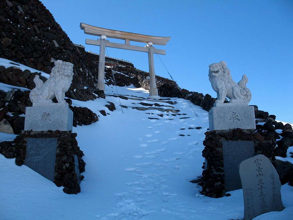 lions and gate just before the edge of the crater