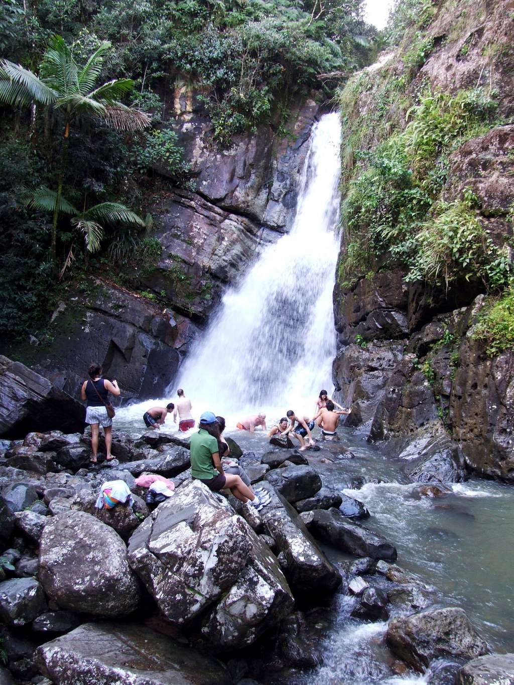 Hikers bathing below La Mina Fall.