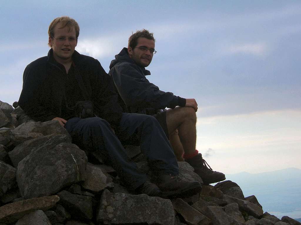 Sitting on the summit of Rhinog Fach with the sun gowing down