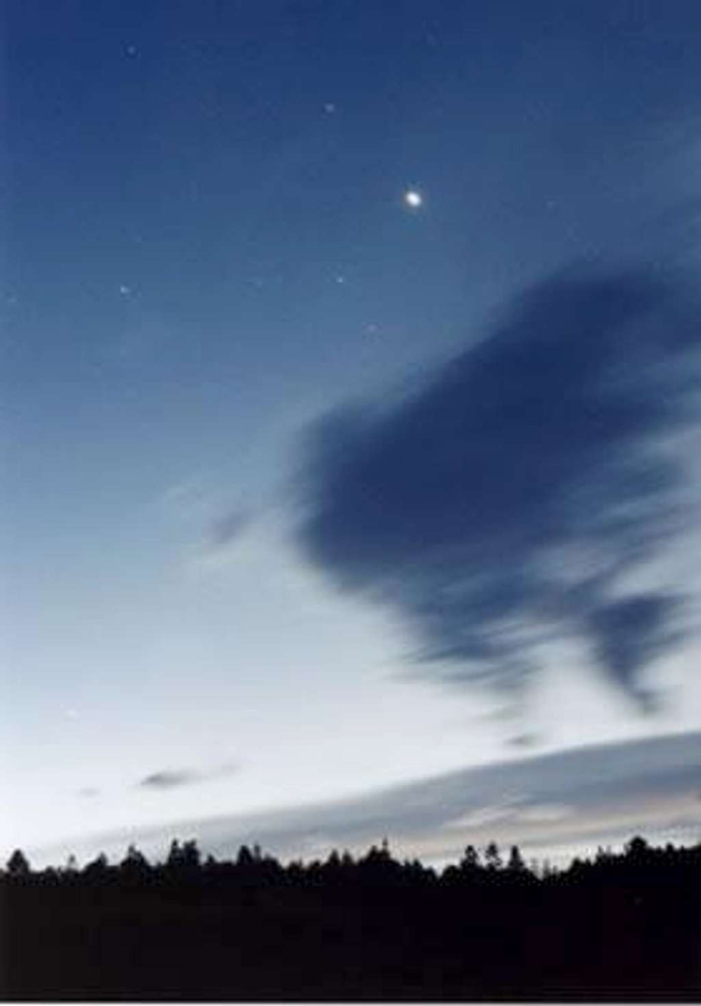 Venus and clouds above the forest