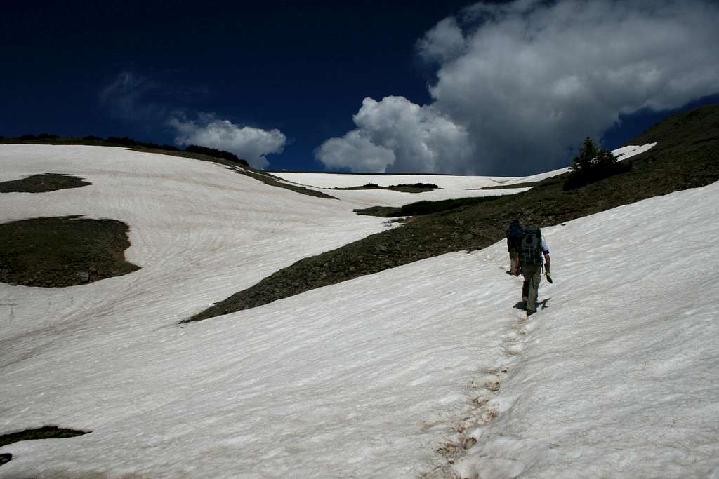  crossing the first snowfield below Tobacco Lake