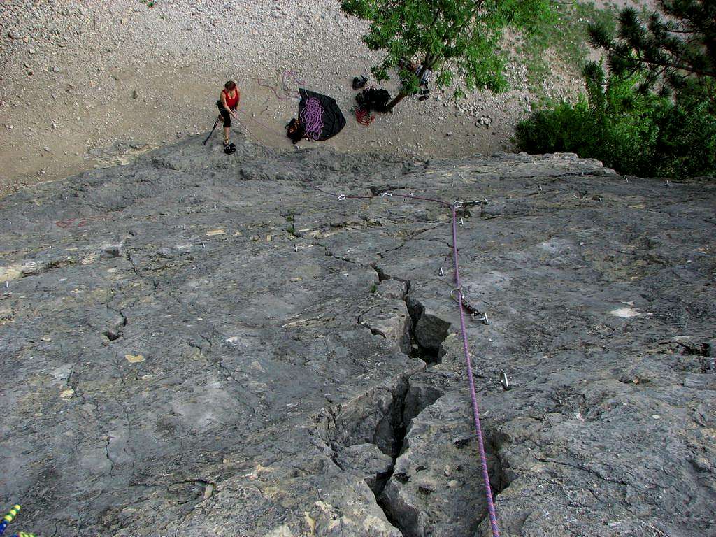 Marlenka is belaying at the foot of the rock