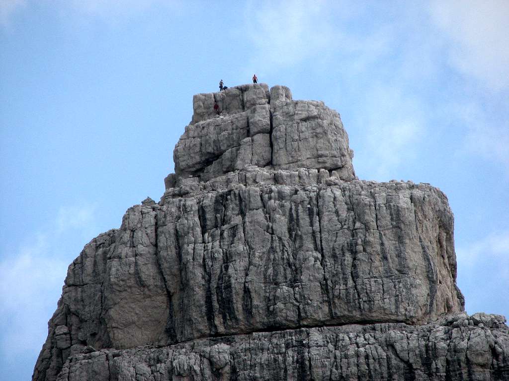 The climber on the summit of the tower Beljaski stolp (Campanile di Villaco, 2247m).