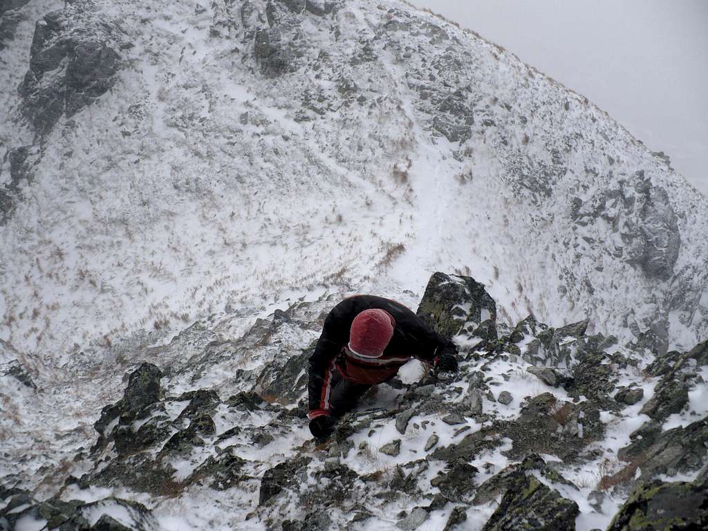 Erik climbing Soliskovy hrb (2129 m) during heavy winds