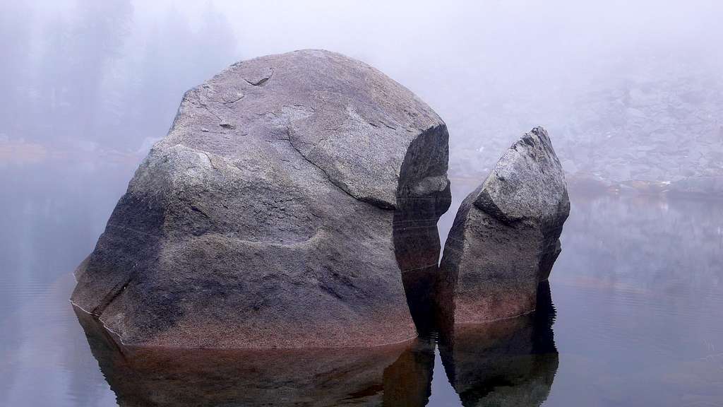 Rock in the middle of heather lake