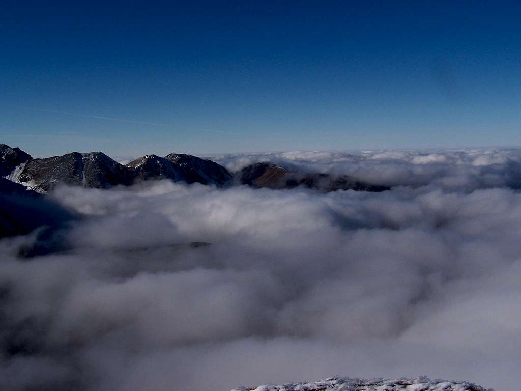 clouds on the summit of Volovec