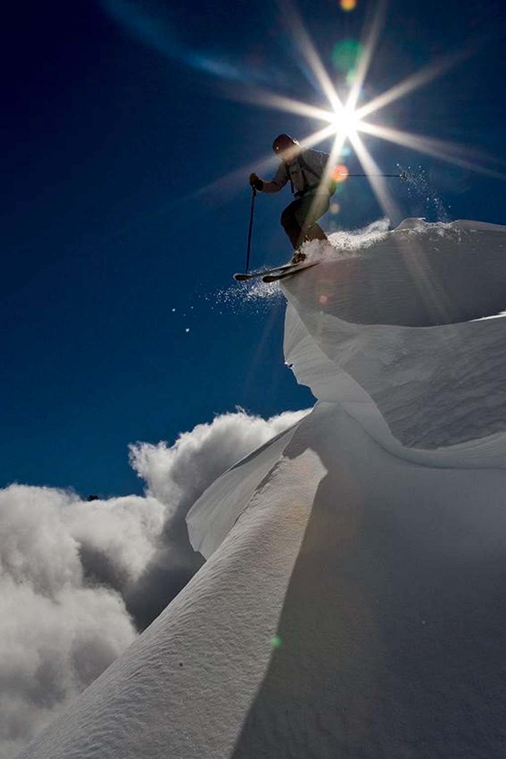 Skiing off a cornice on a perfect powder descent