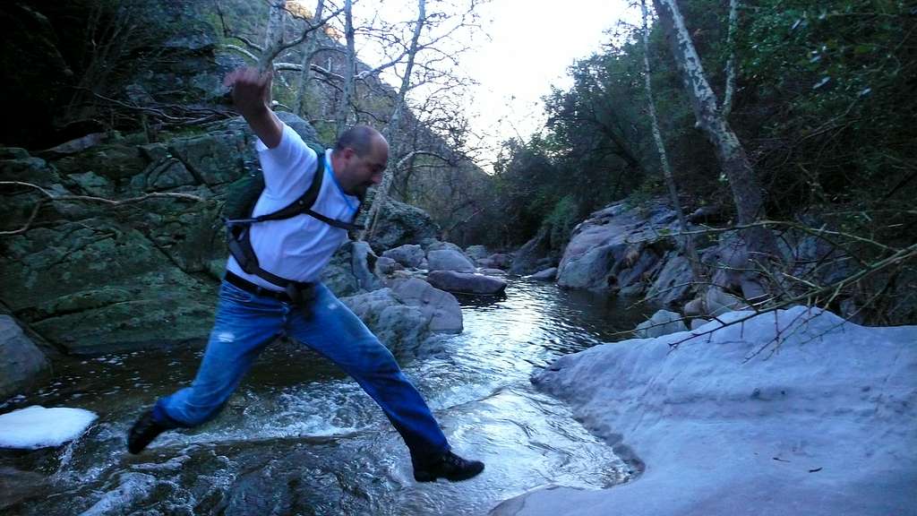 chuck jumping over a stream