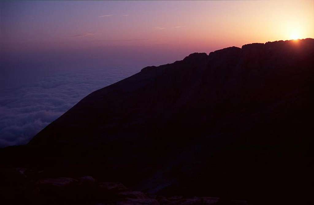 Sun appearing over the ridge